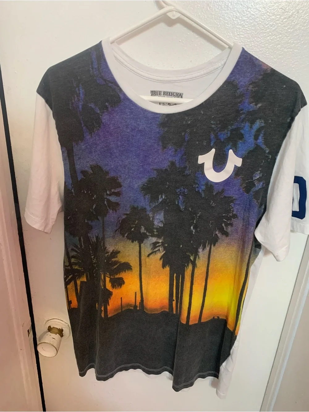 True Religion Men’s White-Rim Graphic Tee with Black and Purple Print